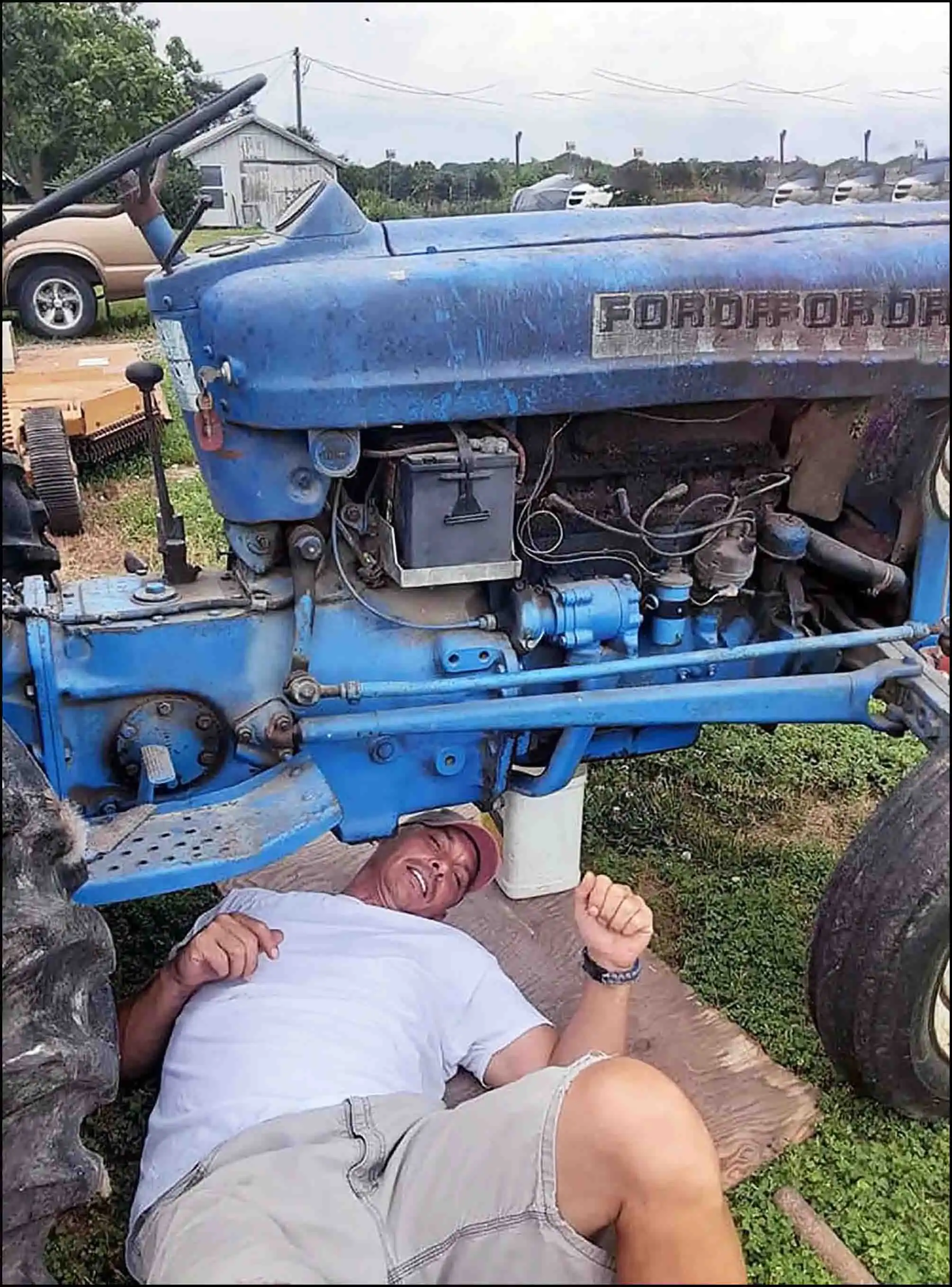 CEO & Veteran David Haave working on the blue tractor in the Spring Break to Mars book; Tipton, MO, USA... -- David Haave